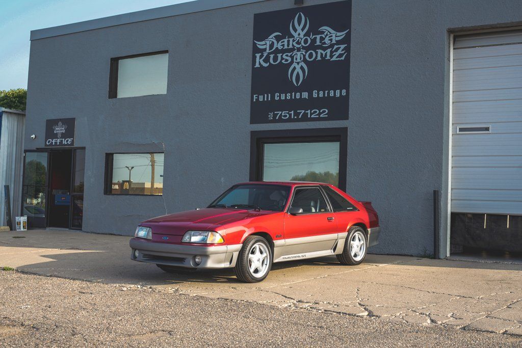 car in front of dakota kustomz garage