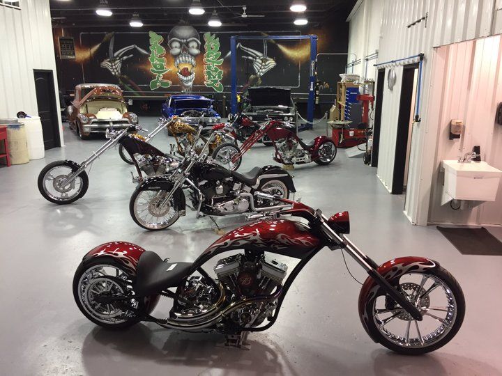 line up of custom motorcycles inside Dakota Kustomz garage