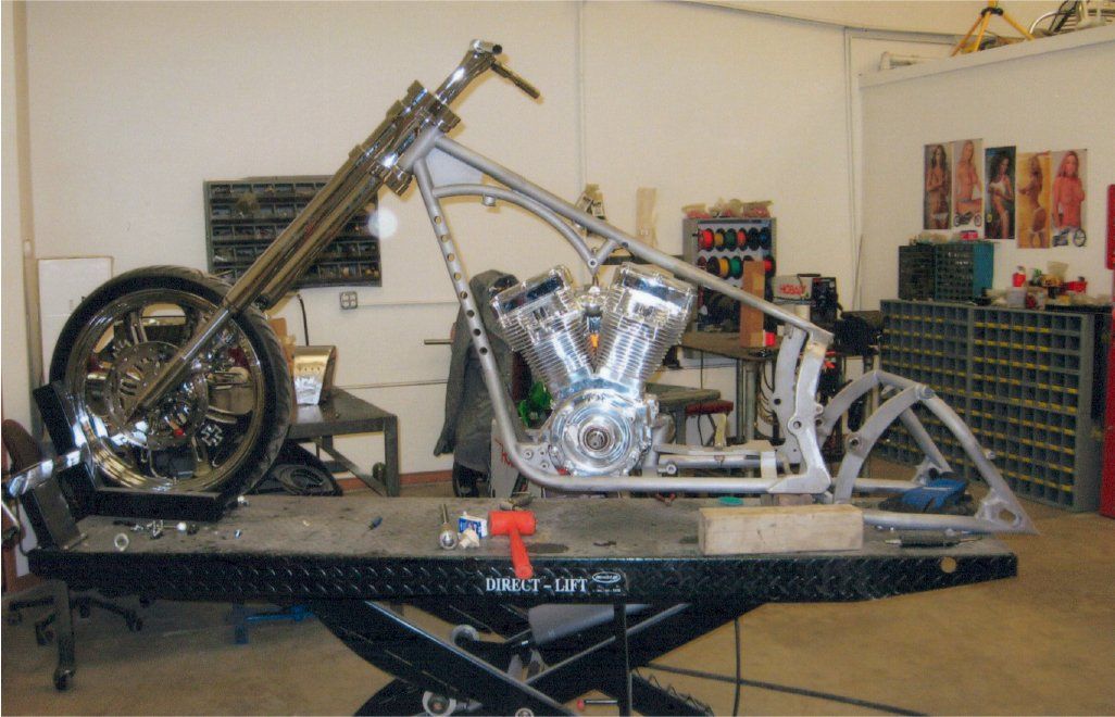 chopper with just frame and engine on workbench