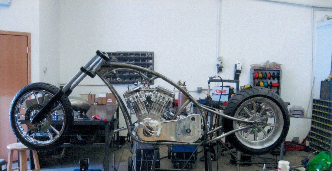 side view of unpainted chopper with no handle bars