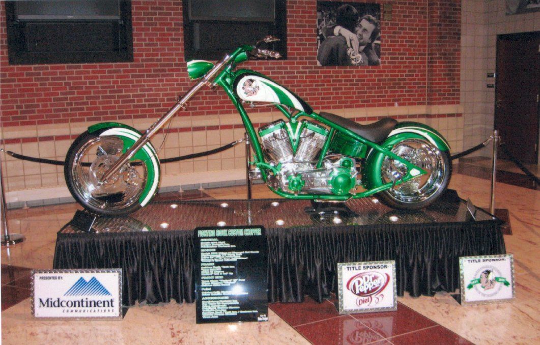 side view of customized green chopper on display showcase