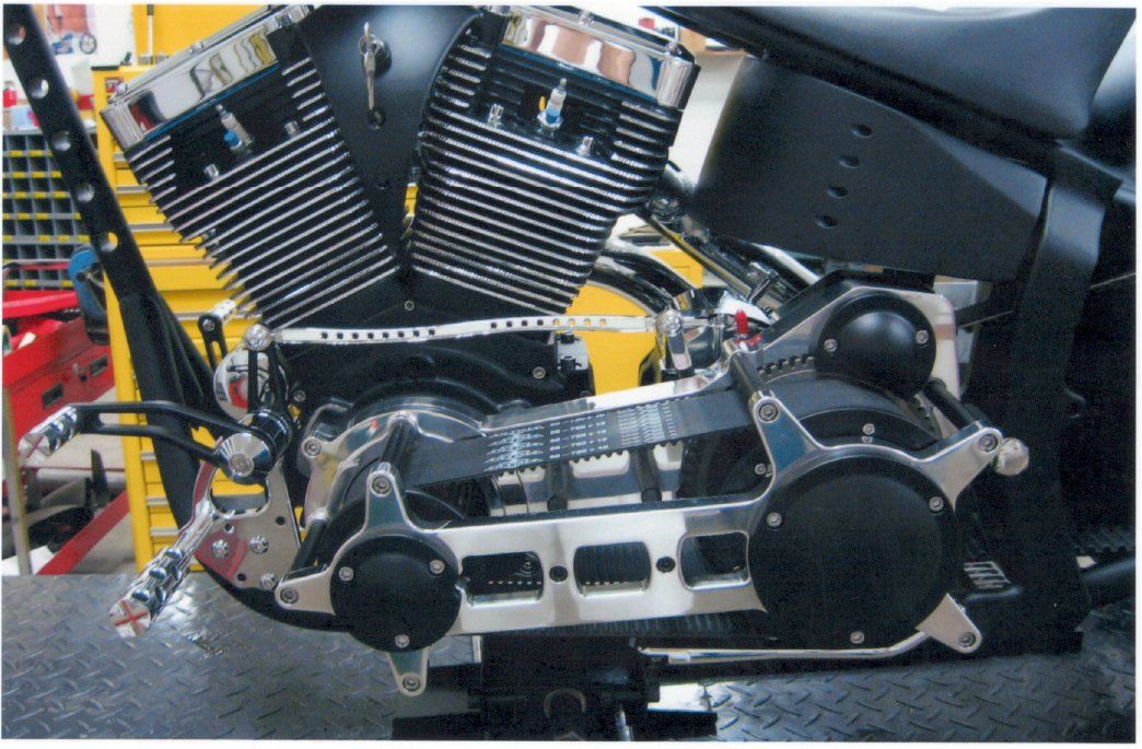 close up of engine on customized chopper on workbench