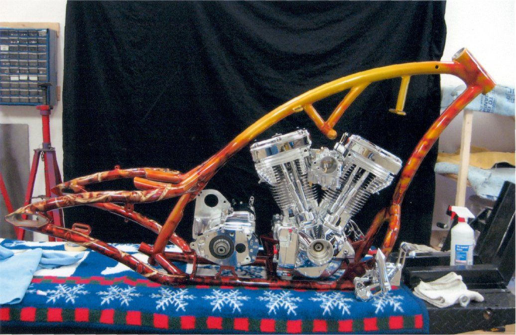 side view of custom chopper frame with engine installed