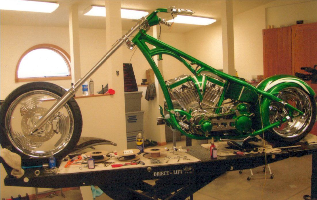 side view of customized green chopper on workbench