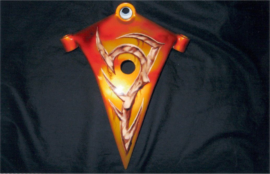 close up of custom orange and red fender with gothic logo design