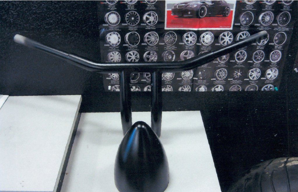 black handle bar on table