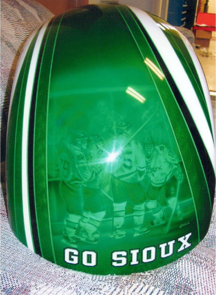 customized green chopper fuel tank with hockey team artwork and 