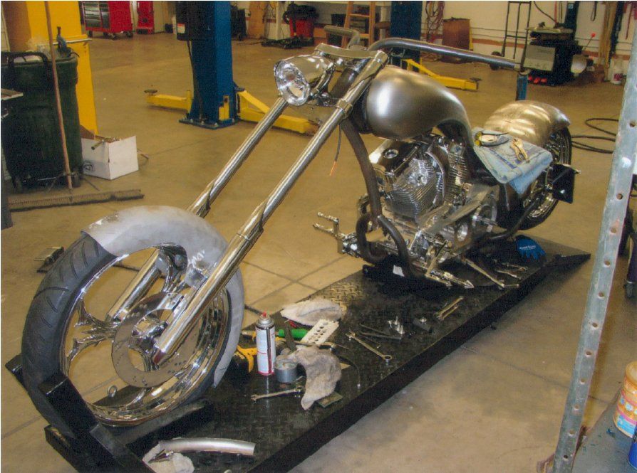 front view of chopper on service bay with no customization