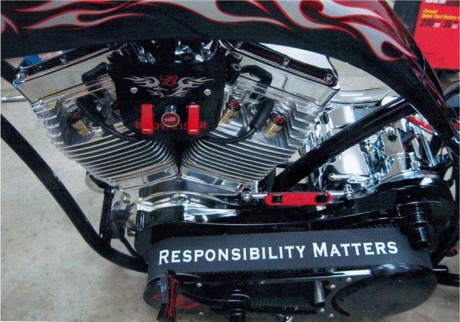 close up of engine with belt stating 