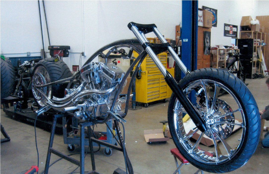 front side view of chopper suspended with no handle bars nor paint