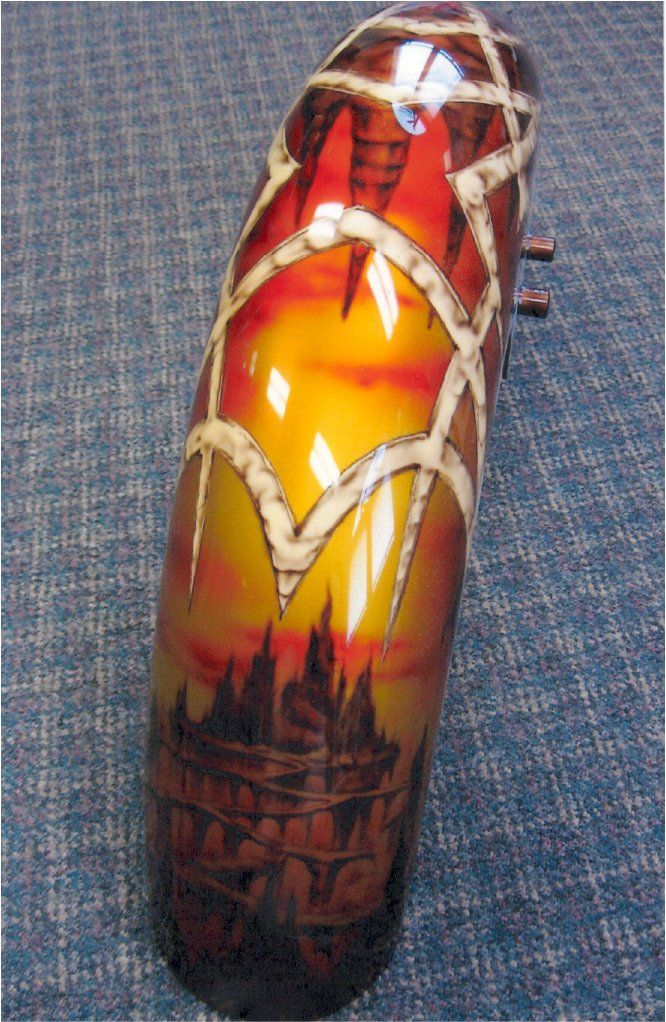 close up of custom orange and red gothic design on fender