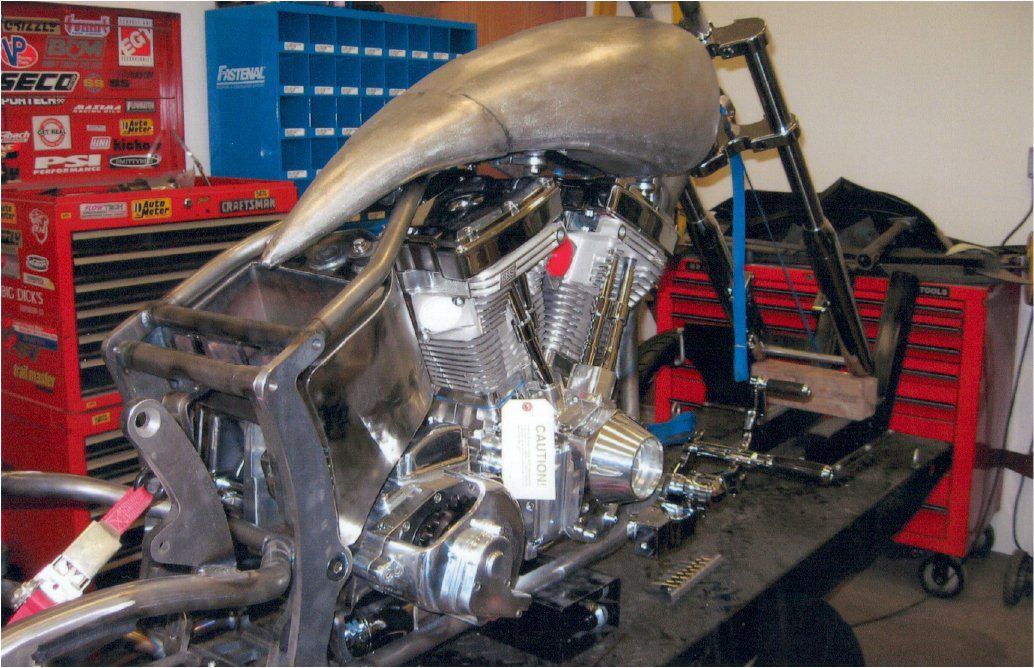 side view of motorcycle on workbench