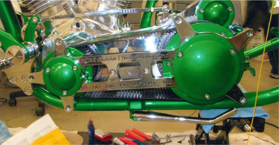 customized green chopper belt brace showing NCAA division 1 national champions 1959, 1963, 1980, 1982, 1987, 1997, 2000