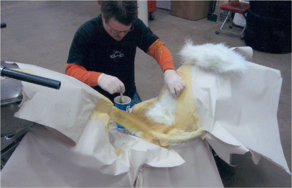 mechanic working on detailing chopper seat