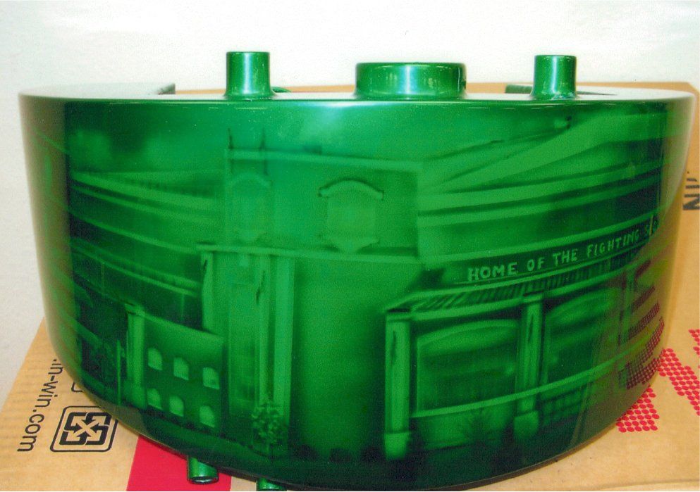 customized building art on customized green chopper part with building showing 