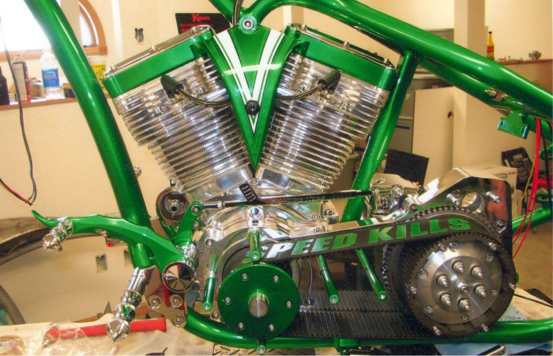 customized green chopper engine with belt added