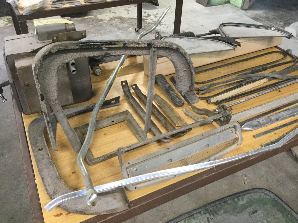 truck parts and frames laid out on table