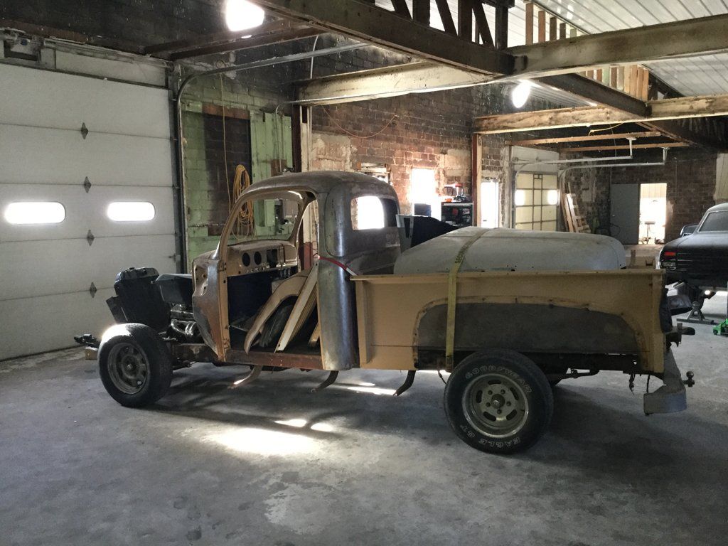 side view of truck fenders and truck parts in bed