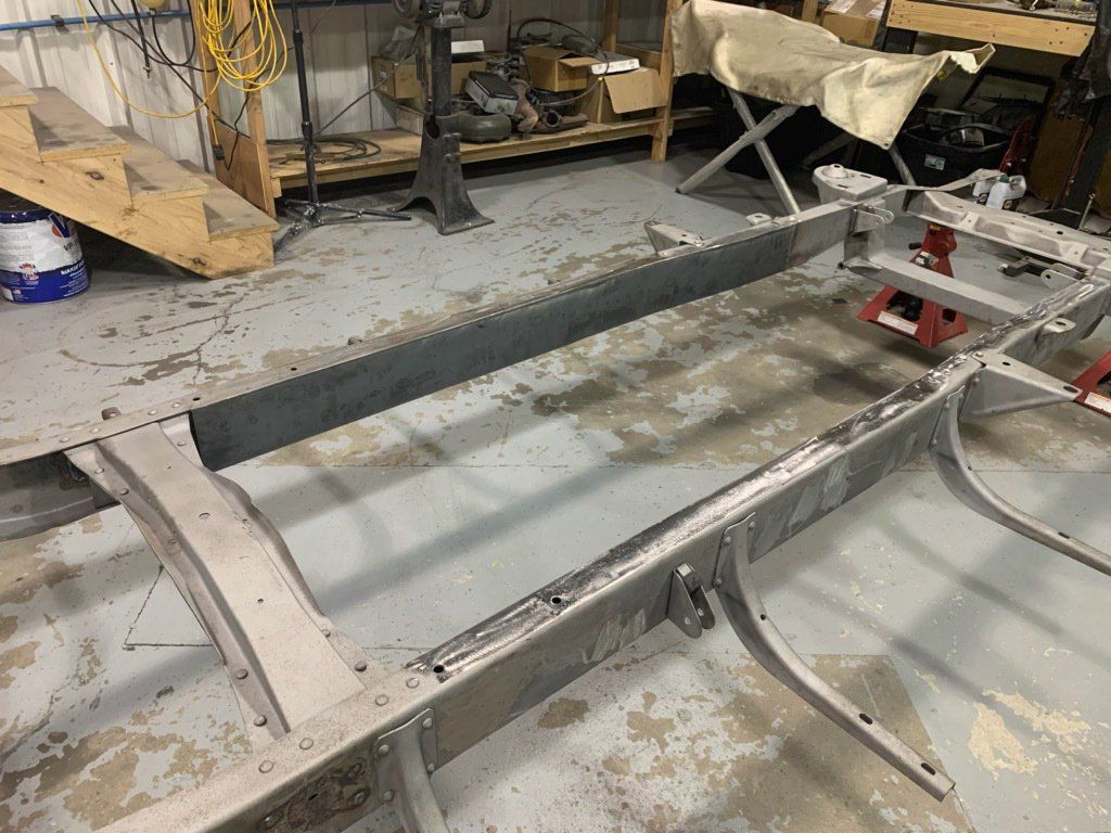 part of truck frame suspended from floor on raisers