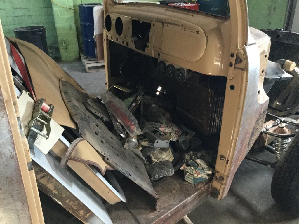 close up of slew of truck parts in front interior of truck