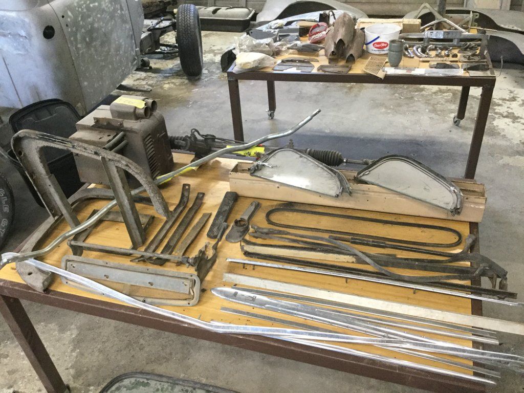 front view of truck frame parts on workbench