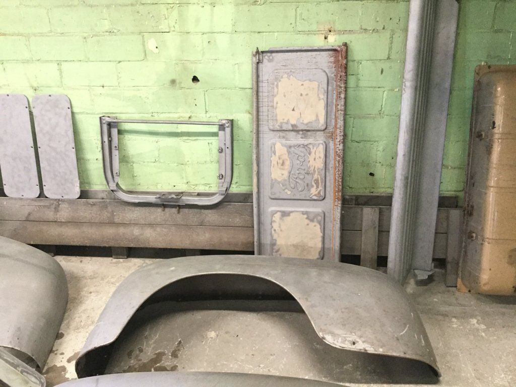 truck bed door against wall with other truck part