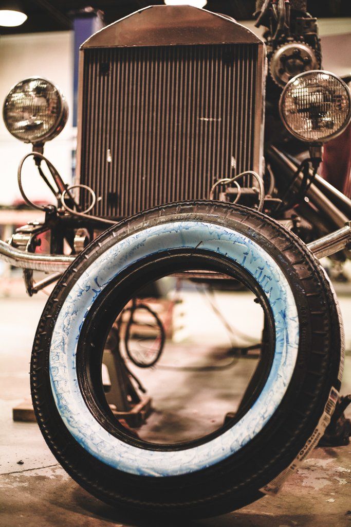 car tire leaning against workbench