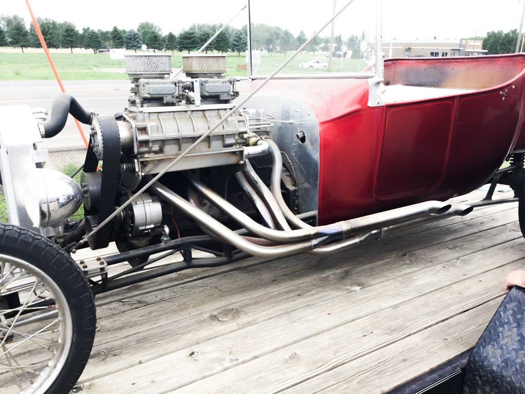 side view of car engine with pipes