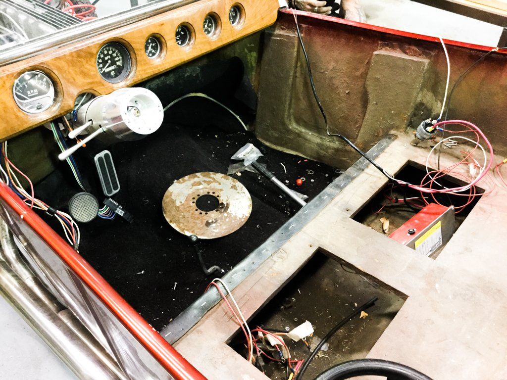 driver console with front seat removed and wires exposed