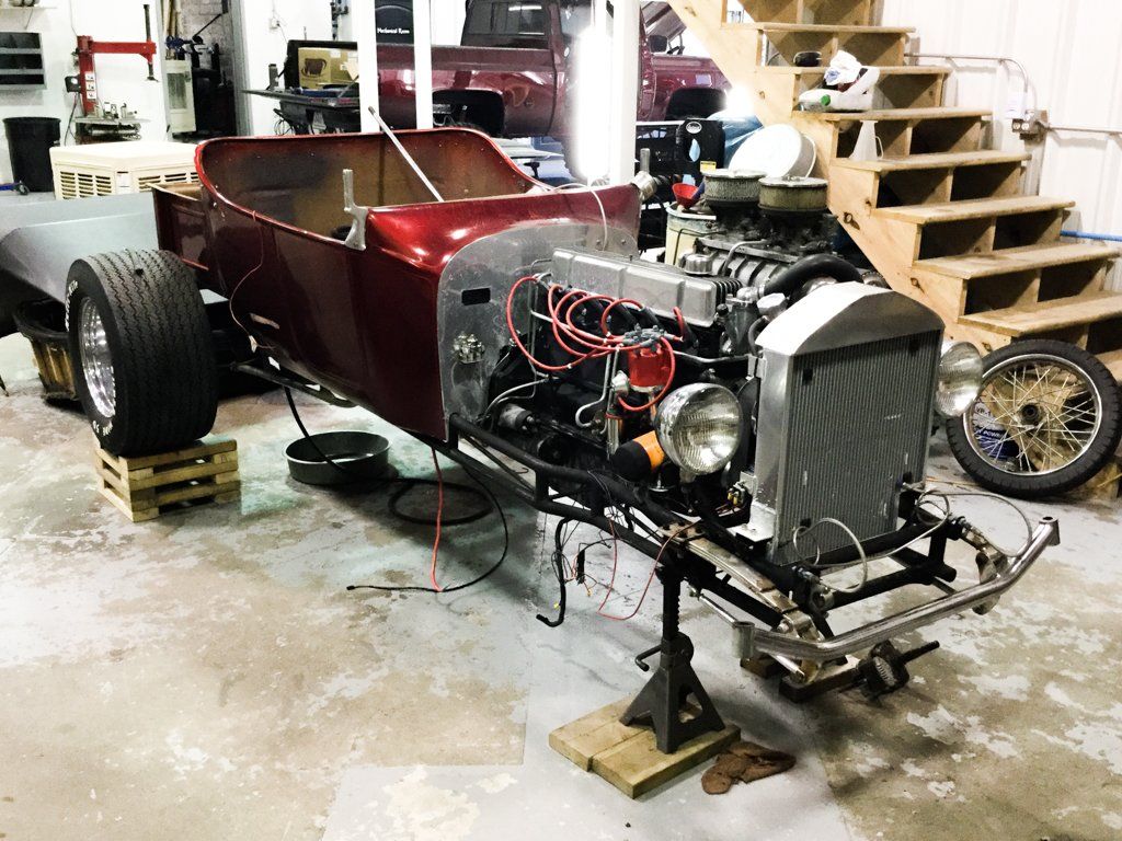 side front view of car with front wheels removed