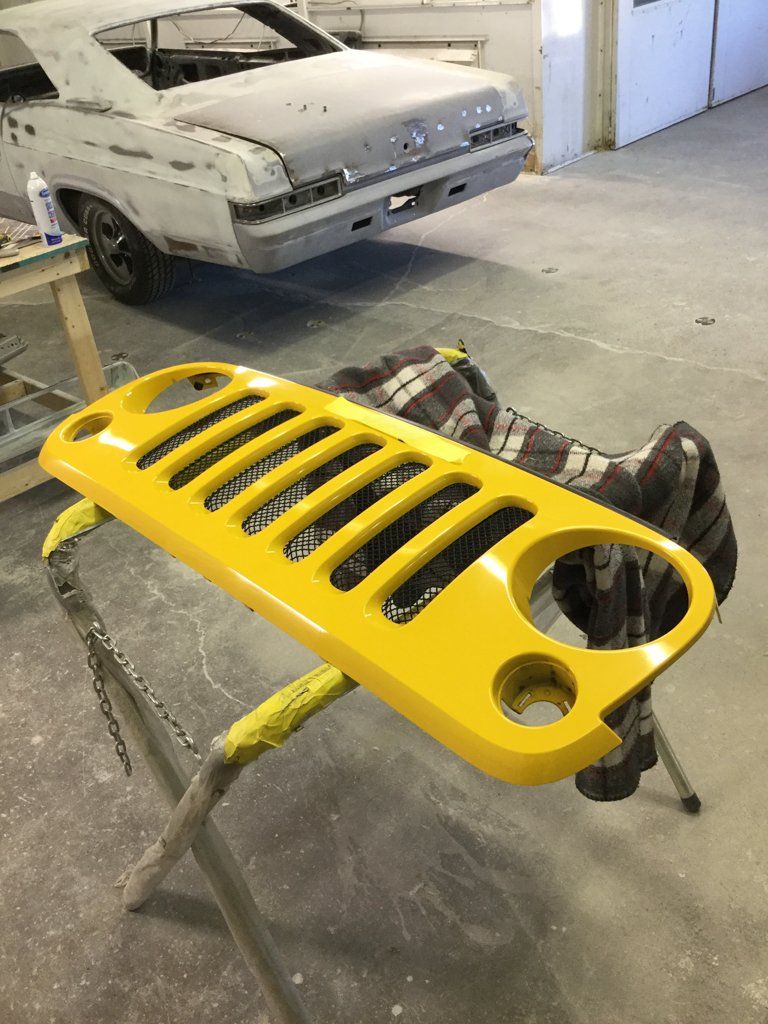 custom 2015 yellow jeep wrangler grill isolated