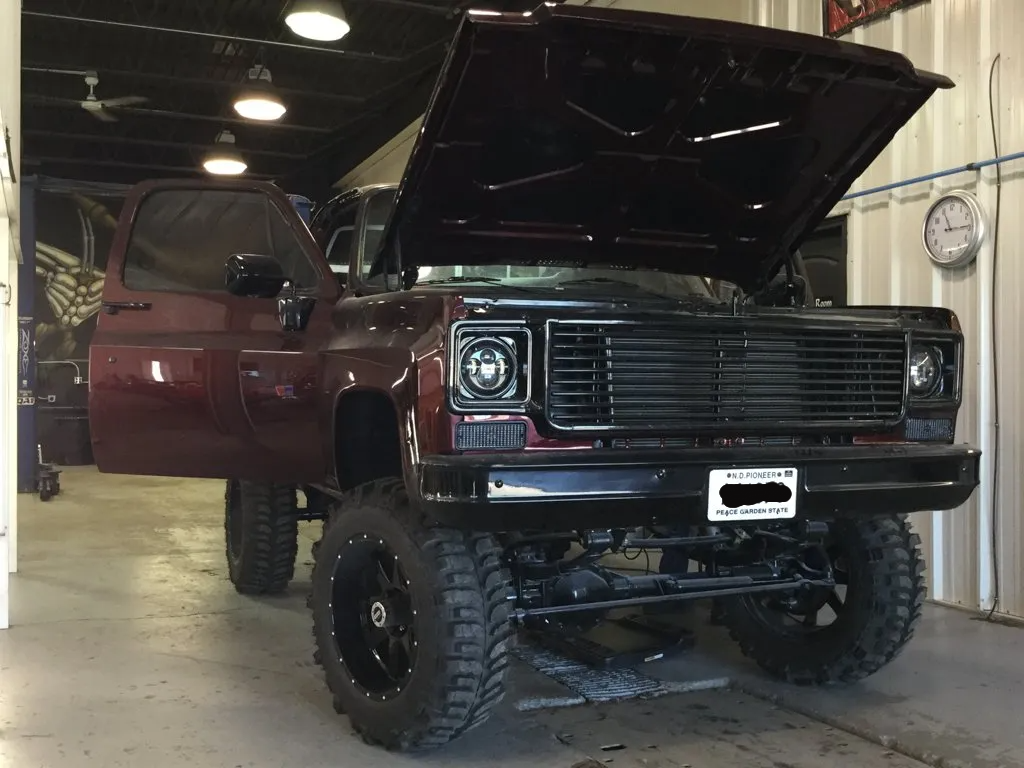 front view of truck with door and hood open