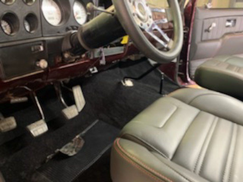 interior view of front seats and floor pedals