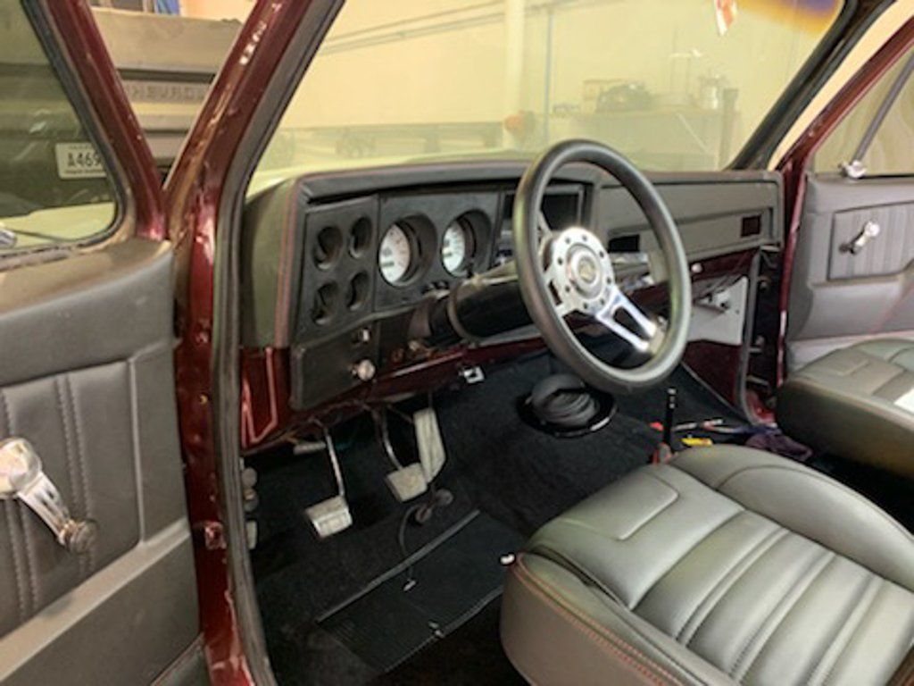 driver side view of steering wheel and front seat