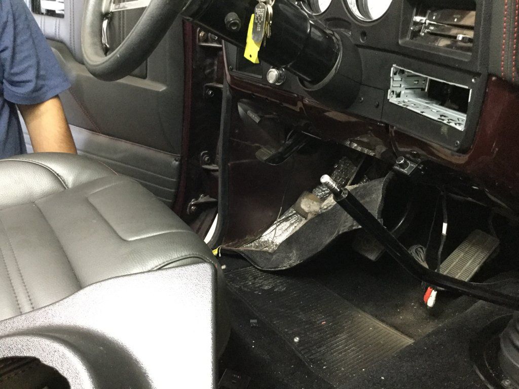 interior view of driver seat flooring with shifter removed