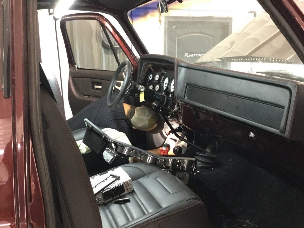 interior view of front seats with cupholders lifted