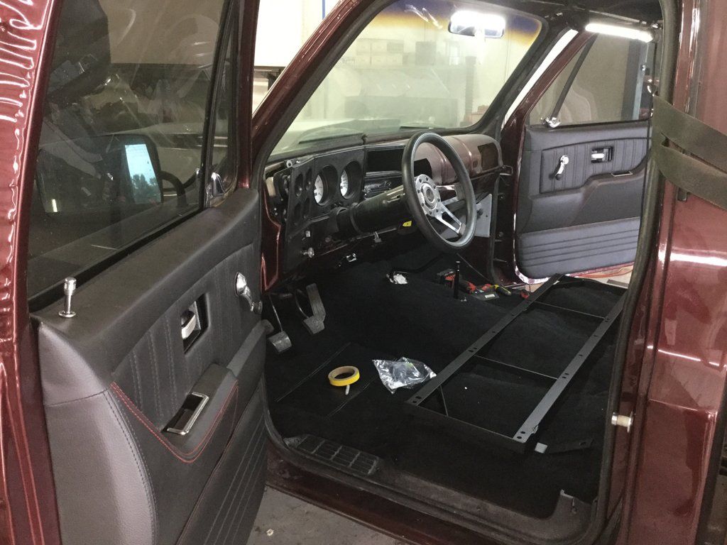 driver side view of front seats and steering wheel