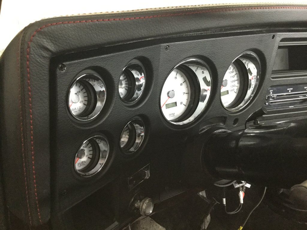 close up of dashboard readings speedometer and odometer
