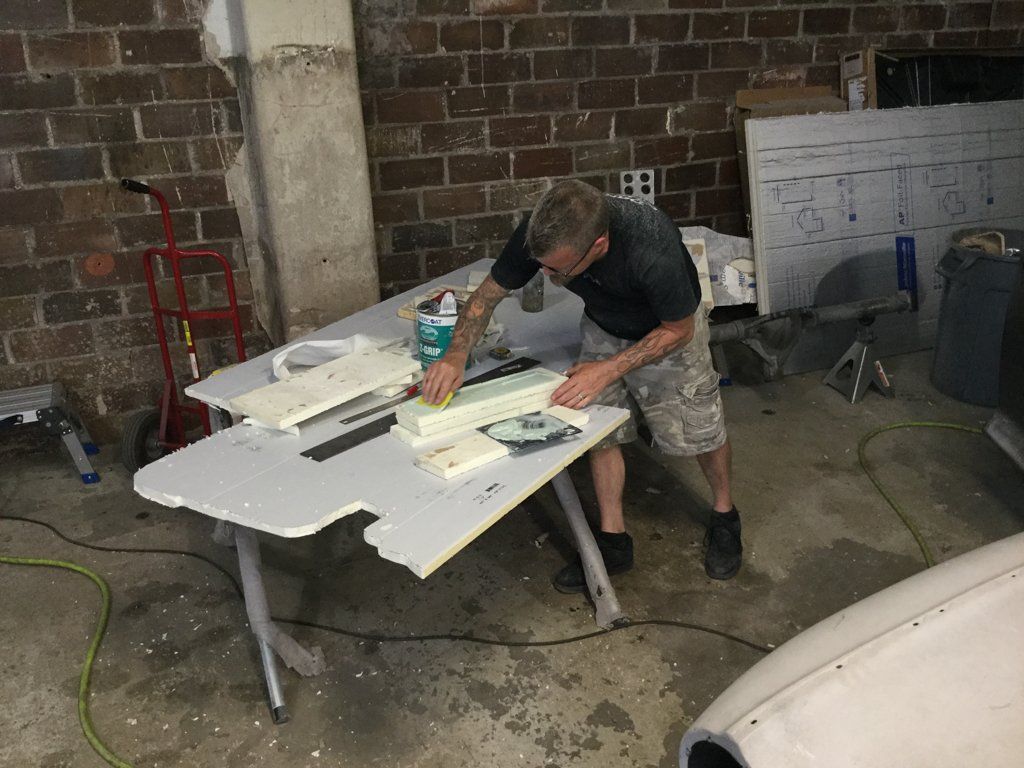 worker working on wood on workbench