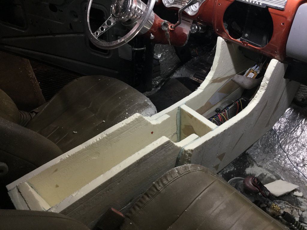 front passenger view of starting wooden console in car