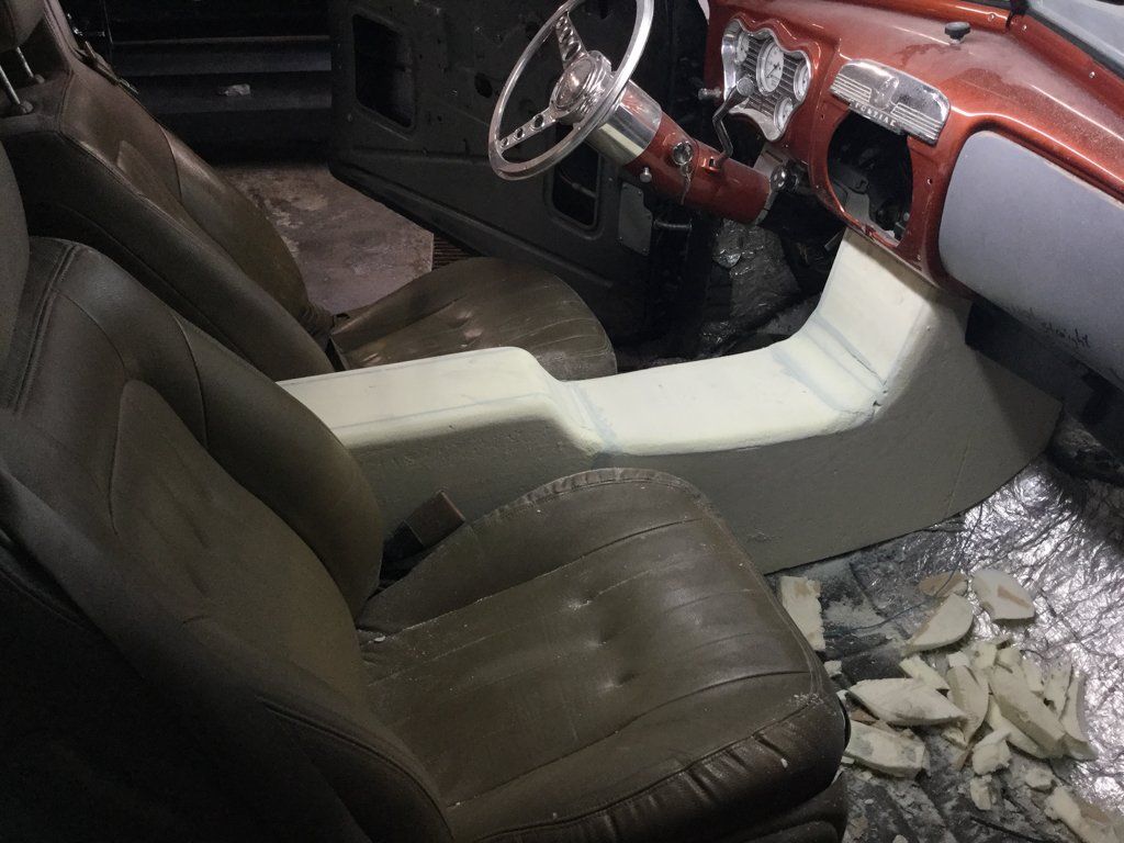 front passenger view of wooden console in car
