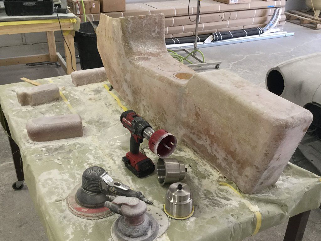 wooden console with cup holder and tools on workbench