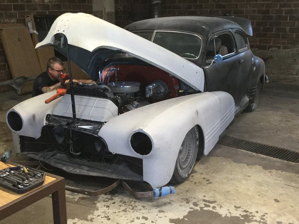 car grill removed with hood open