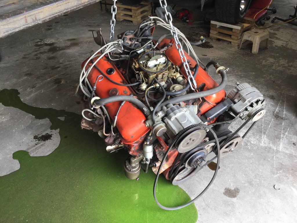 car engine suspended by chains