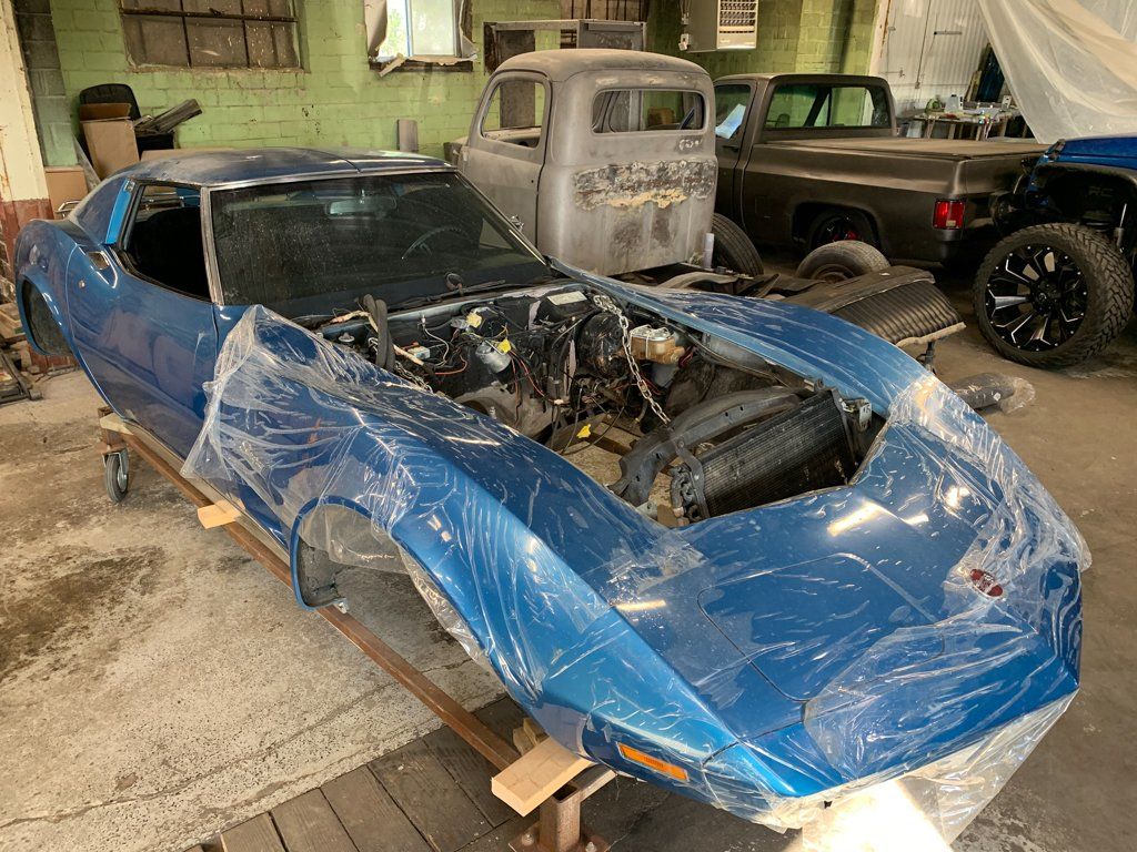 char body with engine exposed covered in plastic