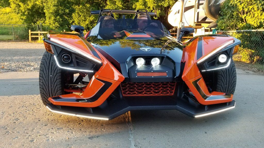 custom orange and black polaris slingshot front