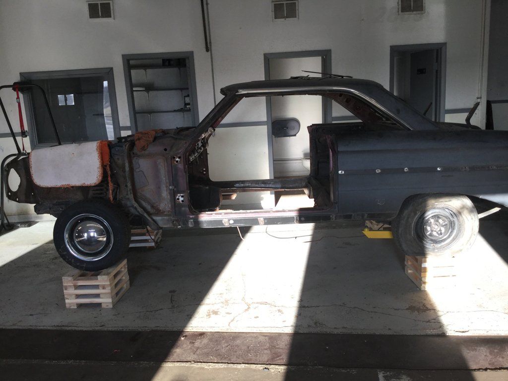 car suspended on crates