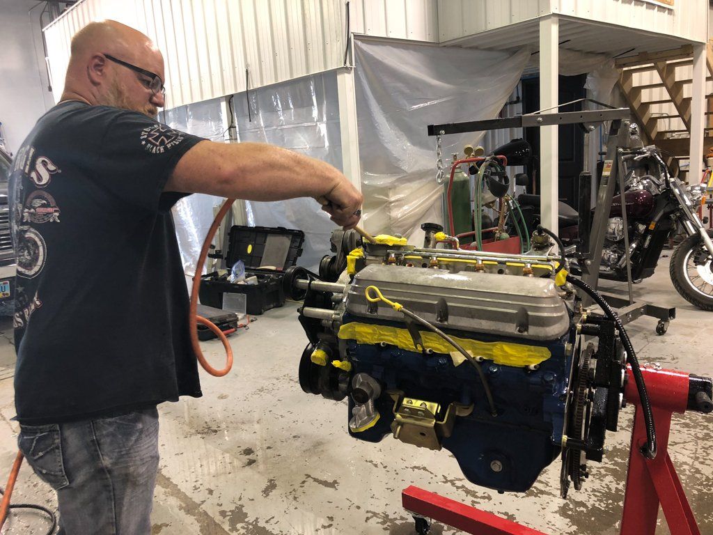 mechanic working on engine