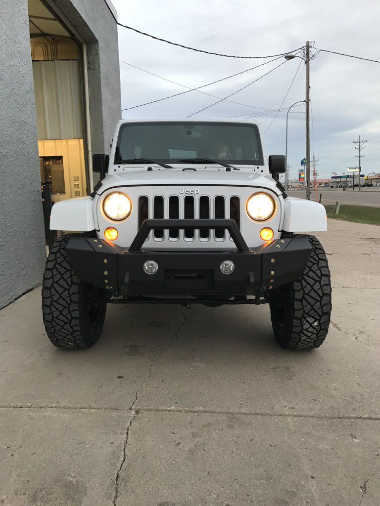front view of white customized jeep