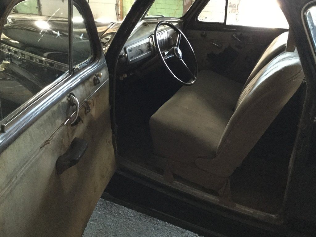 front seats door open with steering wheel